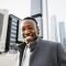 happy-african-man-in-capital-business-city-center-2024-12-05-10-26-25-utc.jpg